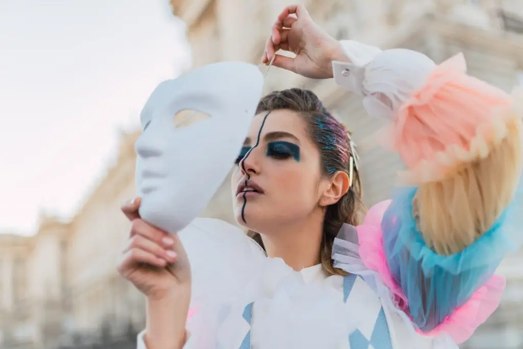 Street performer with white mask